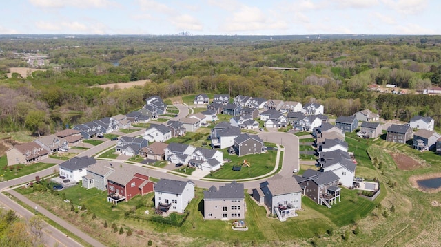 aerial overview of property's location featuring a heavily wooded area and nearby suburban area
