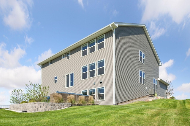 back of house featuring a yard