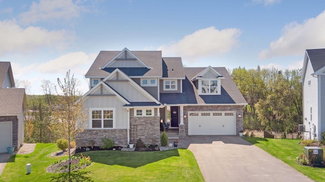 craftsman-style home featuring board and batten siding, stone siding, asphalt driveway, and a front lawn