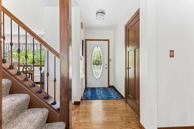 319 Meadow Ln, Benson, MN 56215 - foyer with wood finished floors, stairs, and baseboards