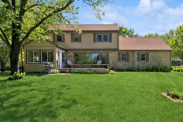 319 Meadow Ln, Benson, MN 56215 - back of property with a yard and a deck