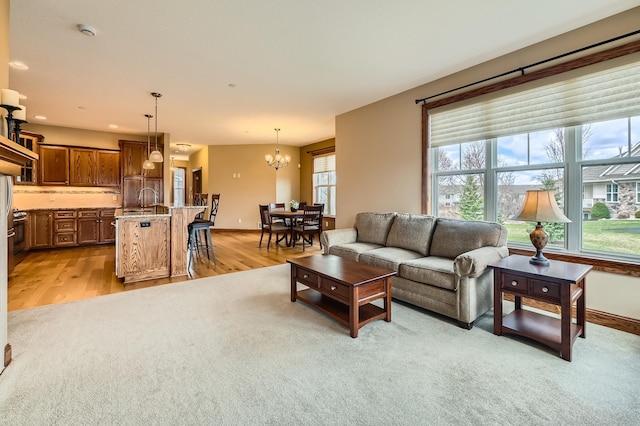 20620 Everton Way N, Forest Lake, MN 55025 - living area with a chandelier and light wood-style floors