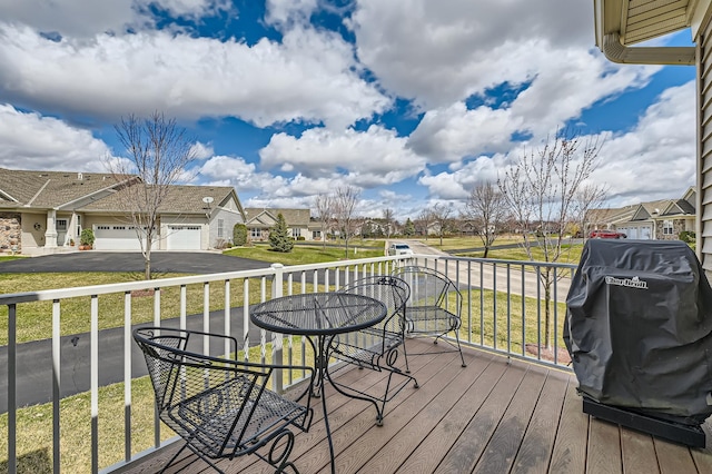 20620 Everton Way N, Forest Lake, MN 55025 - wooden terrace featuring a residential view, an attached garage, asphalt driveway, and a grill