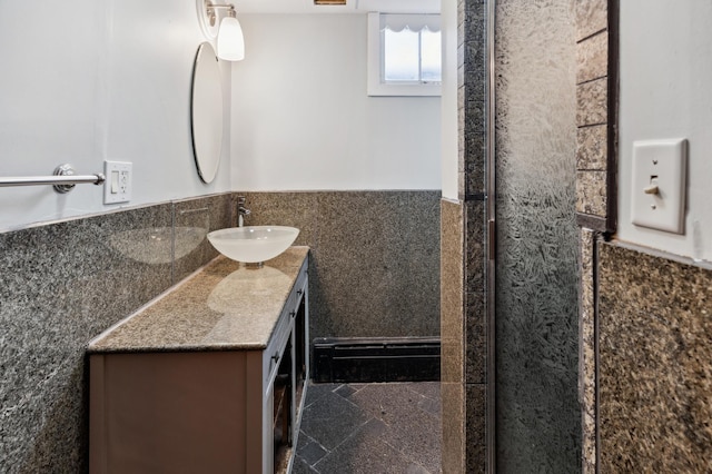 1331 8th Ave N, Saint Cloud, MN 56303 - full bath featuring vanity, a wainscoted wall, tile walls, granite tiled floors, and an enclosed shower