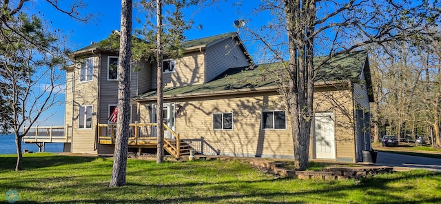 29972 293rd St, Little Elbow Twp, MN 56589 - back of property featuring a lawn and a wooden deck