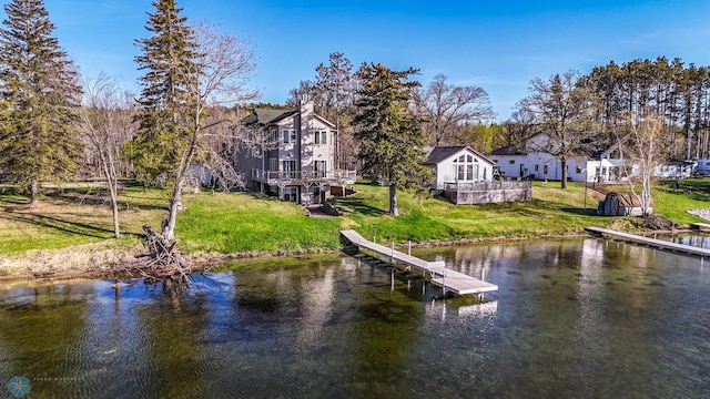 29972 293rd St, Little Elbow Twp, MN 56589 - dock area featuring a lawn and a deck with water view