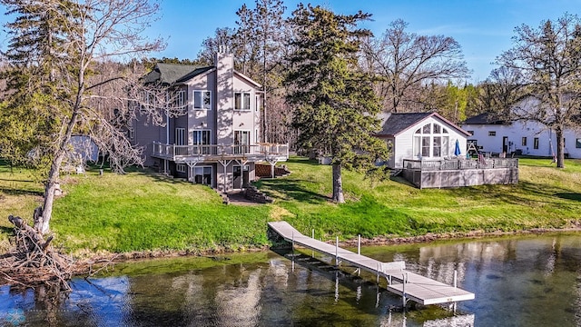 29972 293rd St, Little Elbow Twp, MN 56589 - dock with a lawn and a deck with water view