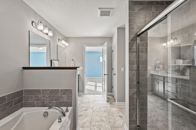 bathroom with a bath, a textured ceiling, a stall shower, visible vents, and marble finish floor