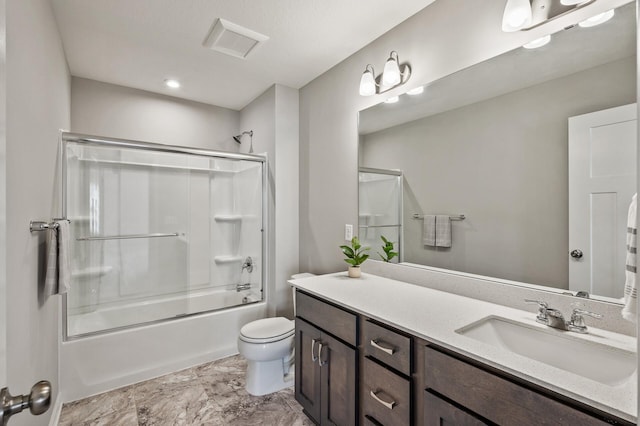 full bath with toilet, vanity, bath / shower combo with glass door, and visible vents
