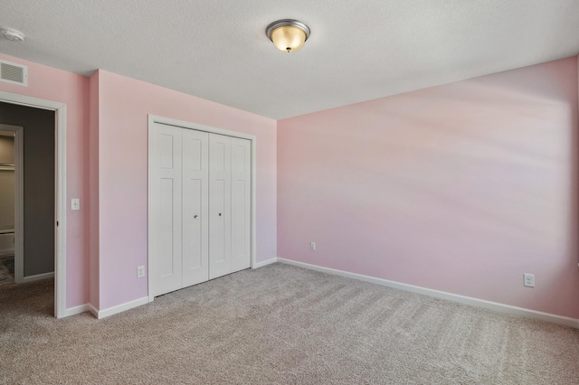 unfurnished bedroom with baseboards and carpet floors
