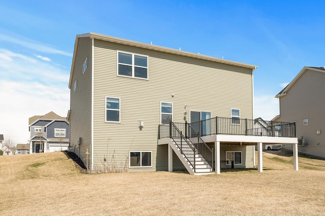 back of property featuring stairway and a wooden deck