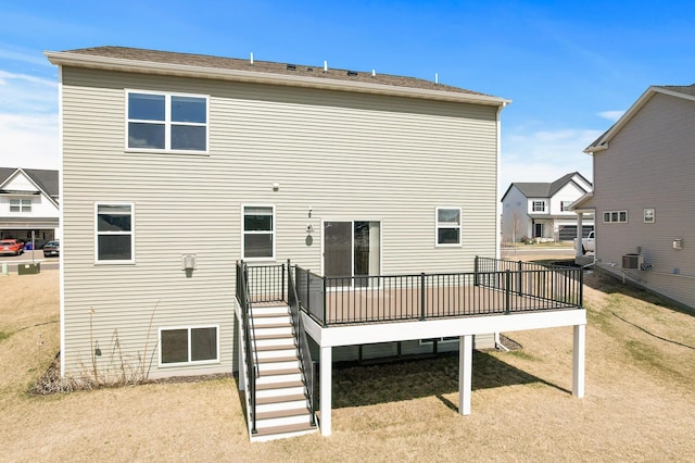 rear view of house featuring a wooden deck, central air condition unit, and stairway