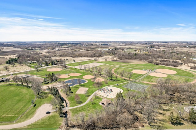 birds eye view of property with view of golf course