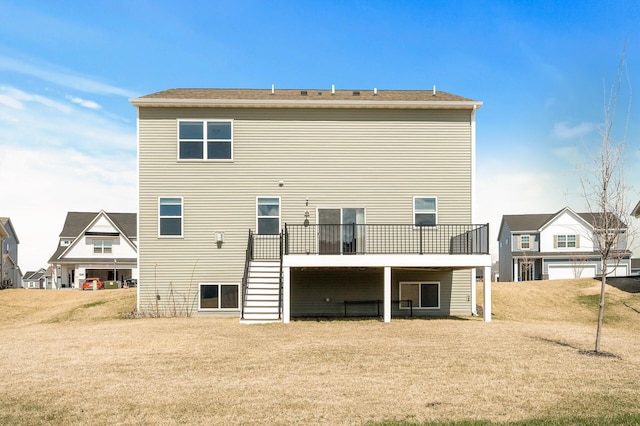 back of house featuring stairway and a deck