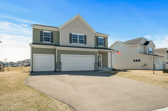 20147 79th Ave, Corcoran, MN 55340 - view of front facade with an attached garage, asphalt driveway, stone siding, and a front lawn