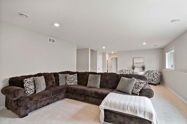 living room with baseboards, light carpet, recessed lighting, and visible vents