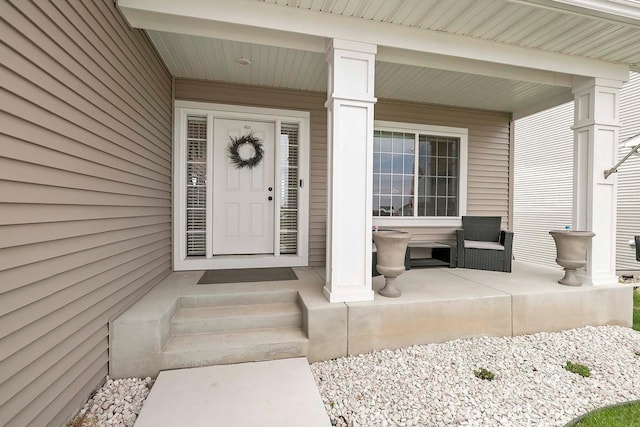 doorway to property featuring a porch