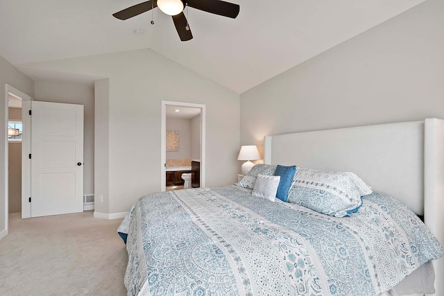 bedroom featuring ceiling fan, light colored carpet, baseboards, lofted ceiling, and ensuite bathroom