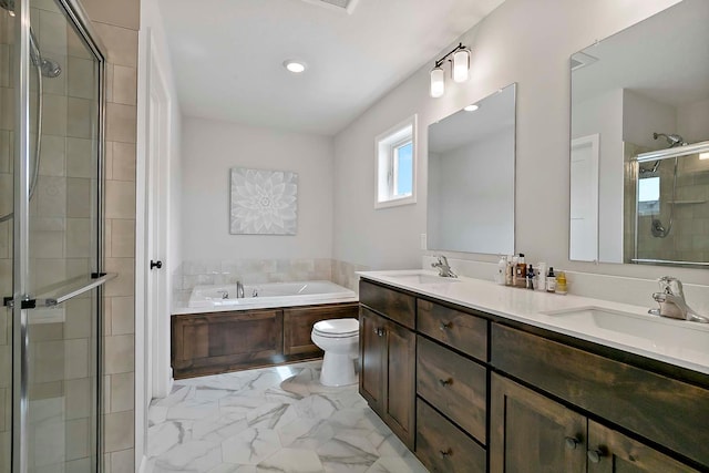bathroom featuring a sink, marble finish floor, a bath, and a shower stall