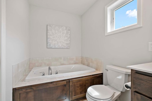 full bath with vanity, a bath, and toilet
