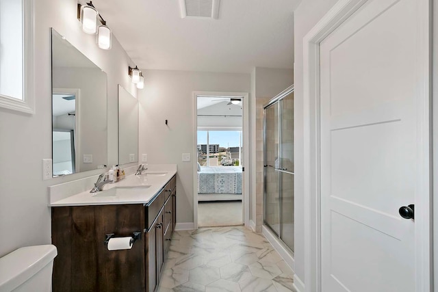 ensuite bathroom with ceiling fan, visible vents, a stall shower, marble finish floor, and ensuite bath