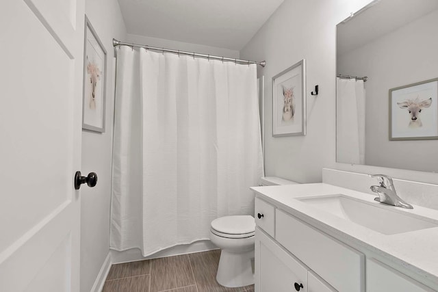 full bathroom featuring toilet and vanity