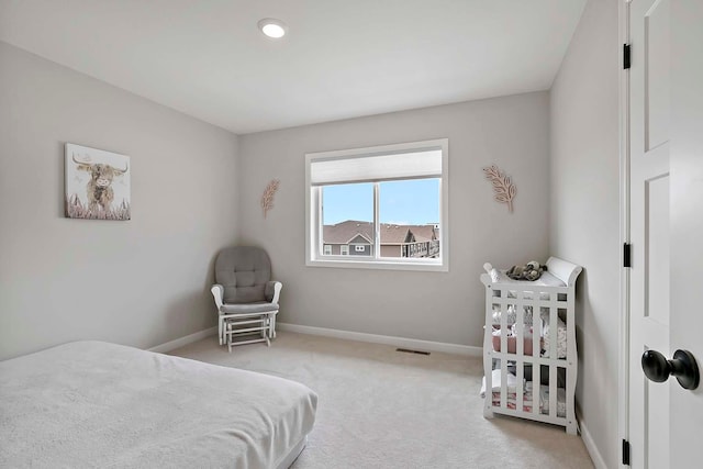 bedroom featuring carpet flooring, baseboards, and visible vents