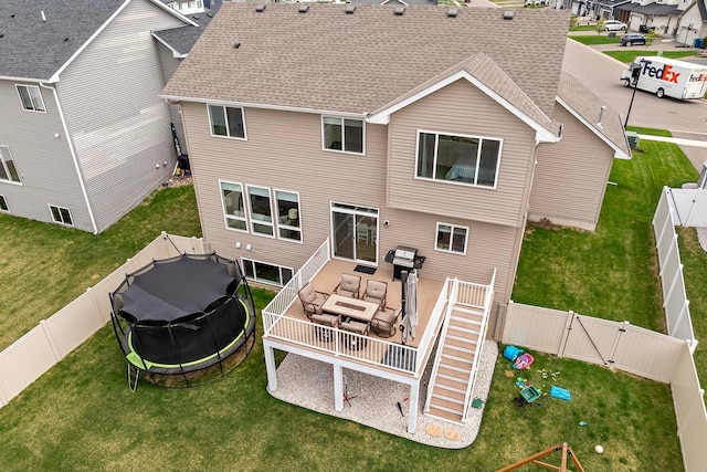 back of property featuring a fenced backyard, roof with shingles, an outdoor living space, a gate, and a lawn