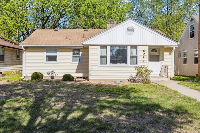 6021 10th Ave S, Minneapolis, MN 55417 - bungalow-style house with a front yard, a chimney, and roof with shingles