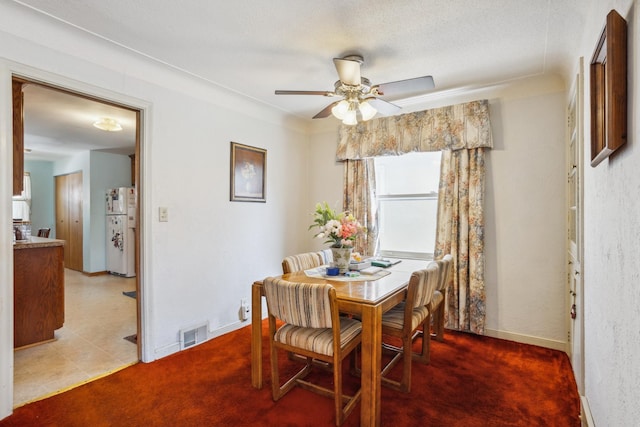 6021 10th Ave S, Minneapolis, MN 55417 - dining space with a ceiling fan, light carpet, and baseboards