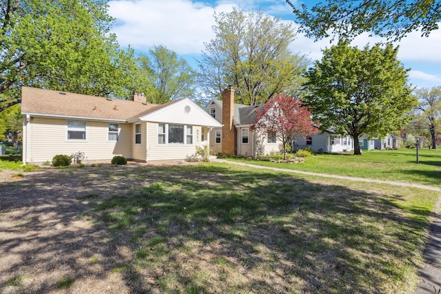 6021 10th Ave S, Minneapolis, MN 55417 - view of front of house with a chimney and a front yard