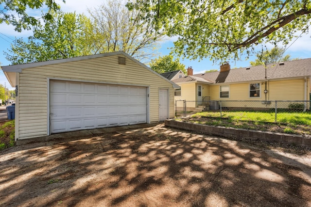 6021 10th Ave S, Minneapolis, MN 55417 - view of front facade with an outdoor structure, a detached garage, and a chimney