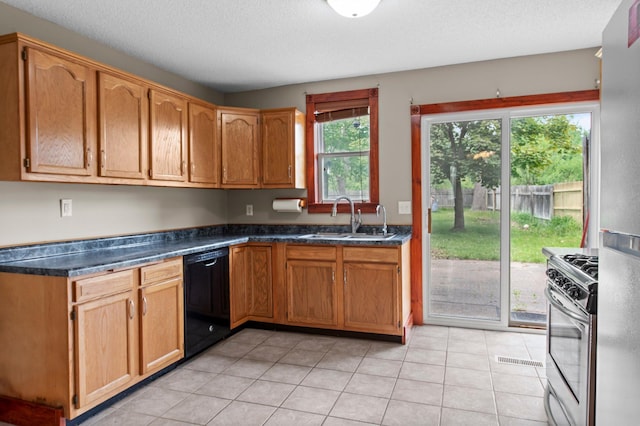 28008 Lake Diann Rd, Baldwin Twp, MN 55398 - kitchen with black dishwasher, stainless steel gas range oven, dark countertops, and light tile patterned flooring