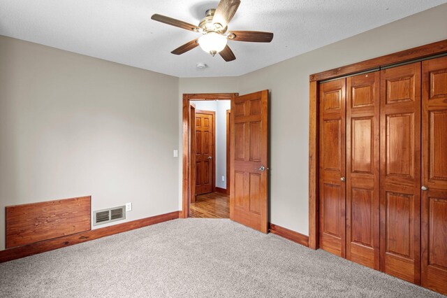 28008 Lake Diann Rd, Baldwin Twp, MN 55398 - unfurnished bedroom with carpet, a closet, and ceiling fan