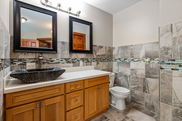 28008 Lake Diann Rd, Baldwin Twp, MN 55398 - bathroom featuring tile walls, vanity, and a wainscoted wall