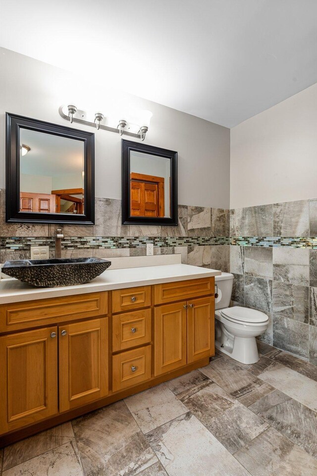 28008 Lake Diann Rd, Baldwin Twp, MN 55398 - bathroom with vanity, tile walls, and a wainscoted wall