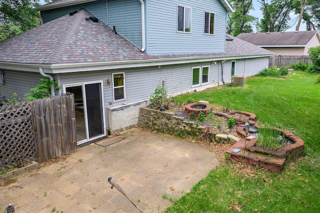 28008 Lake Diann Rd, Baldwin Twp, MN 55398 - back of property with a shingled roof, a patio, and an outdoor fire pit