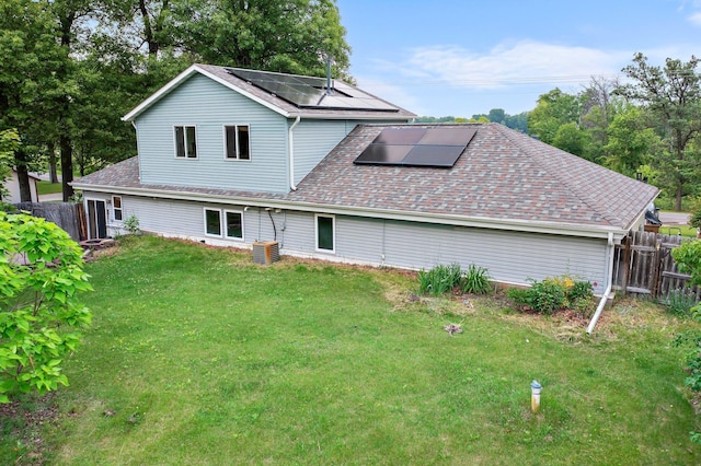 28008 Lake Diann Rd, Baldwin Twp, MN 55398 - rear view of property featuring roof mounted solar panels and a shingled roof
