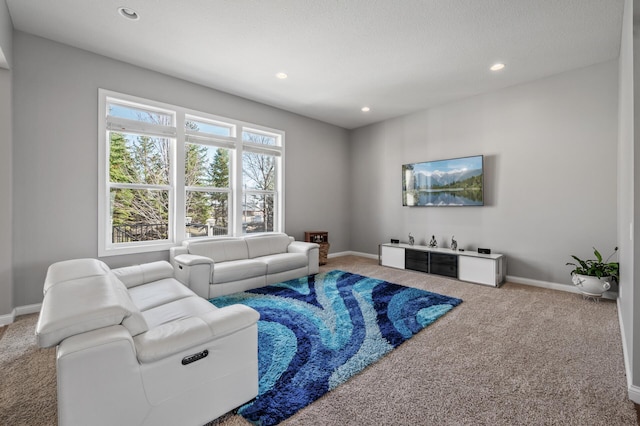 carpeted living room with baseboards and recessed lighting