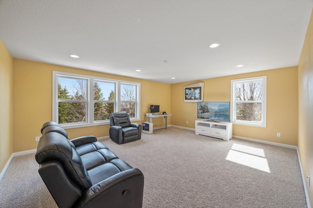 living room featuring carpet floors, baseboards, and recessed lighting