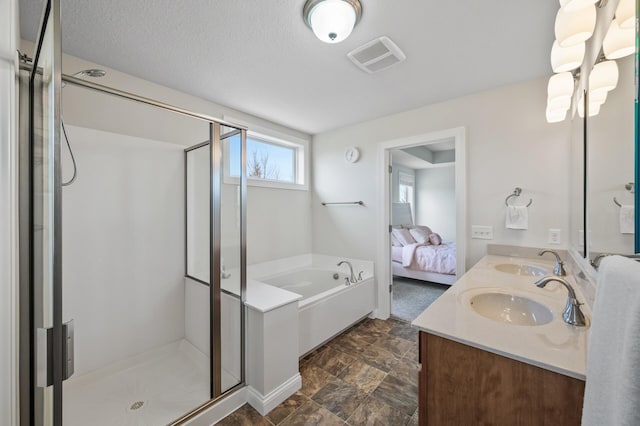 full bath featuring visible vents, a sink, and a stall shower