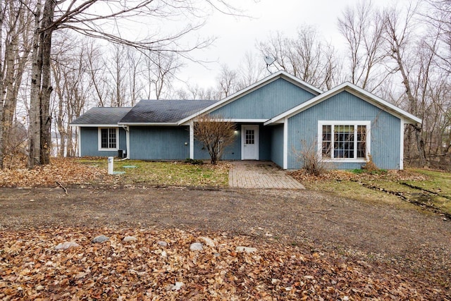 view of front of home with a shingled roof