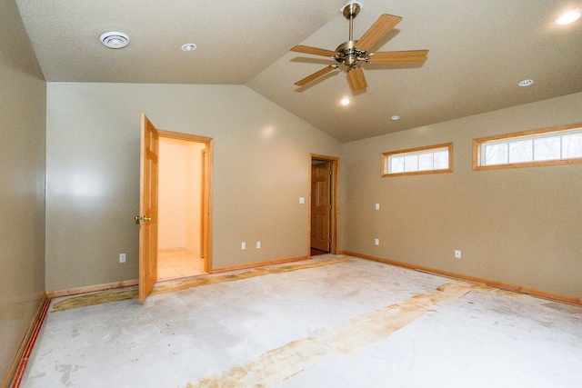 unfurnished bedroom featuring baseboards, lofted ceiling, ensuite bathroom, and recessed lighting