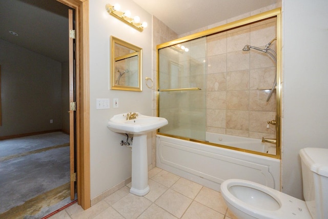 full bath featuring enclosed tub / shower combo, toilet, and tile patterned flooring