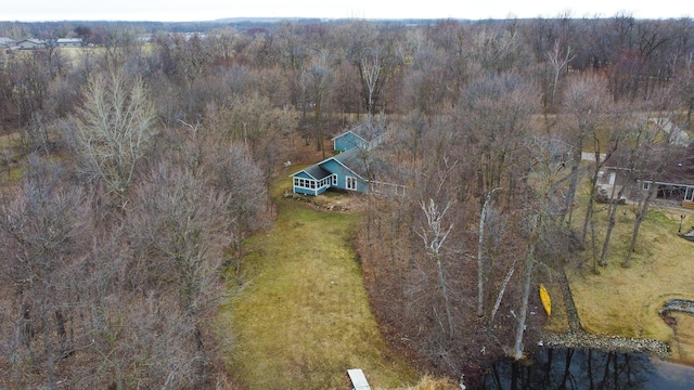 bird's eye view with a wooded view
