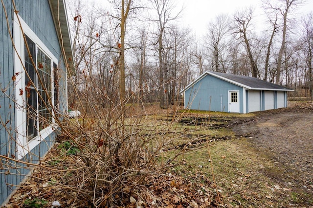 exterior space featuring an outbuilding and a detached garage