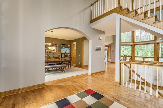 17 Lake Ct, North Oaks, MN 55127 - foyer entrance with a towering ceiling, wood finished floors, and arched walkways