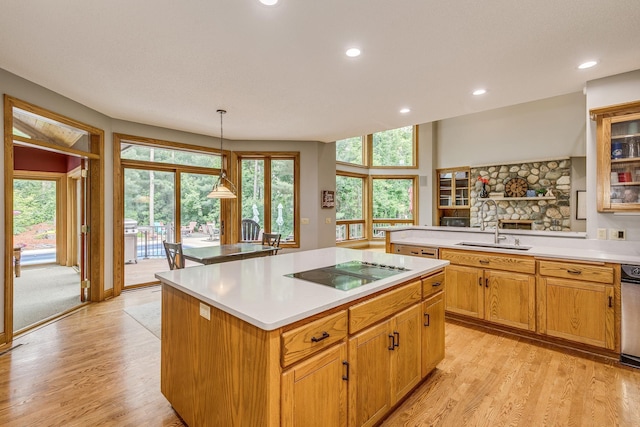 17 Lake Ct, North Oaks, MN 55127 - kitchen featuring black electric stovetop, a kitchen island, light countertops, light wood-type flooring, and recessed lighting
