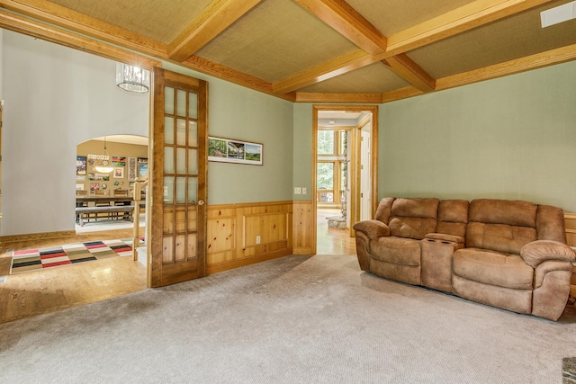 17 Lake Ct, North Oaks, MN 55127 - carpeted living area with beamed ceiling, coffered ceiling, a wainscoted wall, and arched walkways