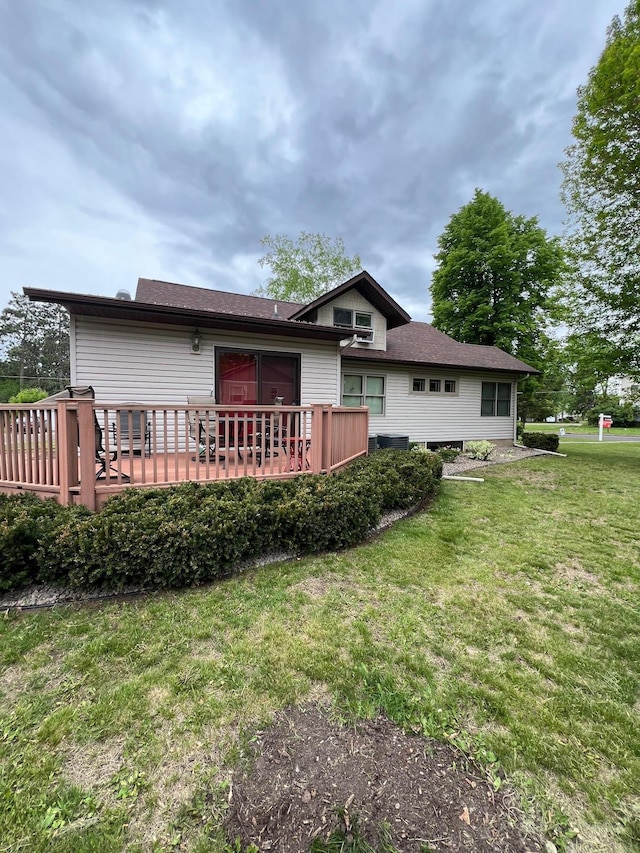 320 State St Unit A, Dresser, WI 54009 - rear view of property with a deck and a lawn
